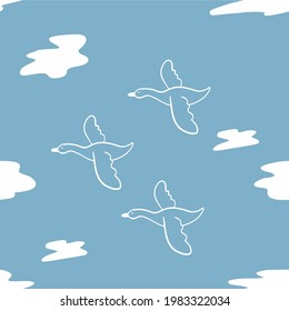 Seamless pattern swans fly among the clouds