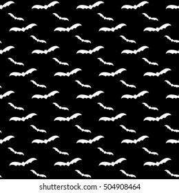 Seamless pattern swarm of bats on the white background.