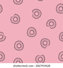 Seamless pattern with sweet donuts on a pink background. Vector illustration.