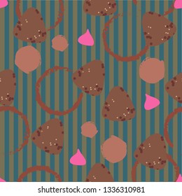 Seamless pattern with sweets and cup stains at striped background.