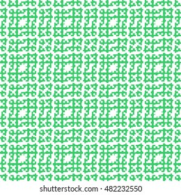 Seamless pattern with symmetric ornament. Green color figures abstract on white background. Embroidery motif. Ornamental wallpaper. Vector illustration 