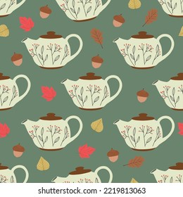 Seamless pattern with teapot, autumn leaves and acorns. Sweet home and cozy autumn concept. Hand drawn vector illustration, flat design