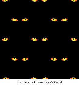 Seamless pattern with terrible glowing yellow-orange eyes in the night on a black background for the holiday Halloween