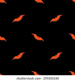 Seamless pattern with terrible orange silhouettes of bats in the night on a black background for the holiday Halloween