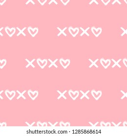 Seamless pattern with “Xoxo" text with hearts isolated on pink background. Vector ink brush sketch. Hand drawn graphic elements.