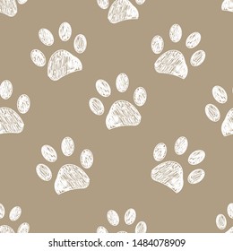 Seamless pattern for textile design. Light brown colored paw print pattern background