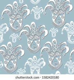 Seamless pattern (texture) with abstract decorative mask (symbol of the carnival in Venice). Suitable for design: fabric, cloth, wallpaper, wrapping, packaging. Vector illustration.