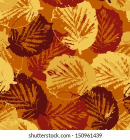 Seamless pattern texture with fallen leaves on warm background