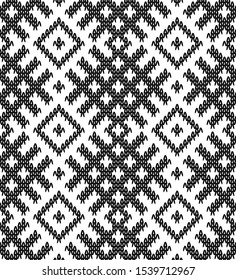 Seamless pattern and texture of knitted fabric with jacquard pattern in folk style