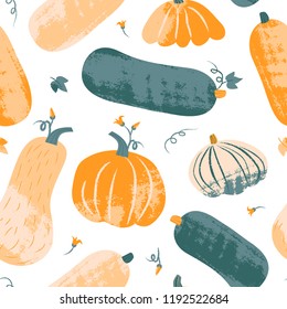 Seamless pattern with textured pumpkin in pastel colors. Hand drawn colorful vector illustration. Craft stamp style. Halloween or harvest background.