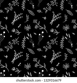 Seamless pattern. Thin branches and flowers on a black background. Delicate pattern.