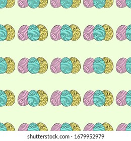 Seamless pattern of three easter eggs on a light green background.