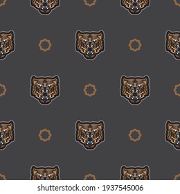 Seamless pattern with tiger face in colored boho style. Polynesian style tiger face. Good for backgrounds and prints. Vector