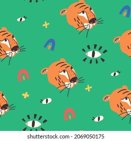 Seamless pattern tiger face eyes on green background. Wild Cat predator orange and black vector modern flat style background