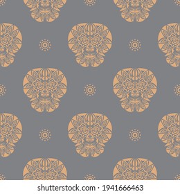 Seamless pattern with a tiger head in a simple style. Good for backgrounds, prints, apparel and textiles. Vector 