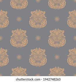 Seamless pattern with a tiger head in a simple style. Good for clothing, textiles and prints. Vector 