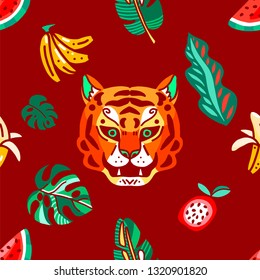 Seamless pattern. Tiger in the jungle among plants and fruits.