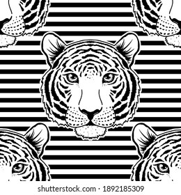 Seamless pattern with tiger muzzle on striped background.