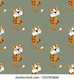 Seamless pattern with tigers. Green background. Chinese tiger.For fabric, wrapping paper, wallpaper.

