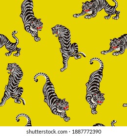 Seamless pattern with tigers in yellow illuminate and gray color. Vector.