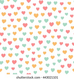 Seamless pattern with tiny colorful hearts on a white background. Vector repeating texture.