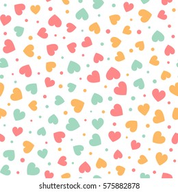 Seamless pattern with tiny colorful hearts and dots on a white background. Vector repeating texture. Perfect for printing on fabric or paper.