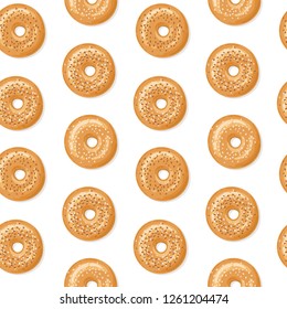 Seamless pattern with top view of fresh bagels, white and brown sesame seeds on top, white background. Delicious breakfast. Vector seamless pattern.