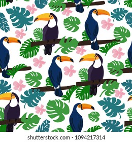 Seamless pattern of toucans in tropical leaves