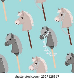 Seamless pattern of toy horse heads for hobbyhorsing on blue background