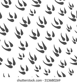 Seamless pattern with traces of dinosaur.