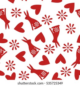 Seamless pattern with traditional folk motif with rabbits, flowers and hearts. Perfect for wrapping paper, wallpaper, repeating elements, vintage design, notebook cover, fabric clothes design.