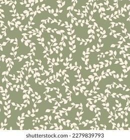 Seamless pattern of tree branches with small green leaves interwoven in an ornament 