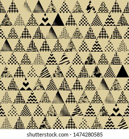 Seamless pattern of a triangles.. Aztec ornament. Vector image.