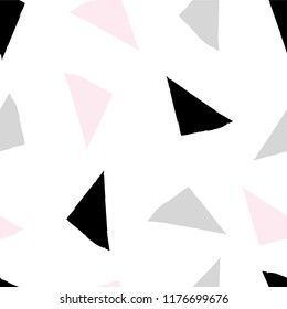 Seamless pattern with triangles. Random black, pink, gray triangles on white isolated background. Abstract vector background. Suitable for printing on fabric, clothing, textiles, wrapping paper.