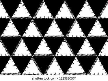 Seamless pattern of triangles with torn edge. Black and white composition.
