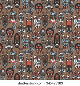 seamless pattern with tribal african masks, vector illustration