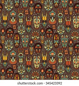 seamless pattern with tribal african masks, vector illustration
