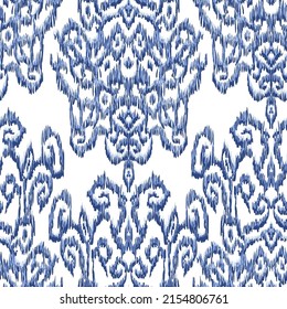 Seamless pattern - Tribal Art Ikat in traditional classic blue and white colors. Damascus - in Syrian Flower Pattern. Boho style. Printing on fabric. Ornamental plant pattern imitating weaving embroid