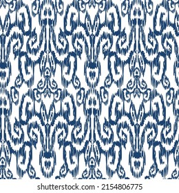 Seamless pattern - Tribal Art Ikat in traditional classic blue and white colors. Damascus - in Syrian Flower Pattern. Boho style. Printing on fabric. Ornamental plant pattern imitating weaving embroid
