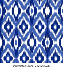 Seamless pattern Tribal Art Ikat Ogee in traditional classic blue and white colors. Boho style. Indian indigo