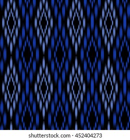 Seamless pattern Tribal Art Ikat Ogee in traditional classic blue and black colors. Boho style.