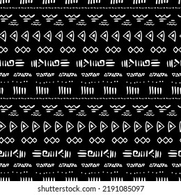 Seamless pattern with tribal aztec motives. Black and white abstract wallpaper in boho style with hand drawn elements. 