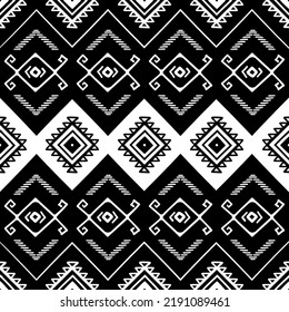 Seamless pattern with tribal aztec motives. Black and white abstract wallpaper in boho style with hand drawn elements. 