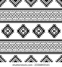 Seamless pattern with tribal aztec motives. Black and white abstract wallpaper in boho style with hand drawn elements.
