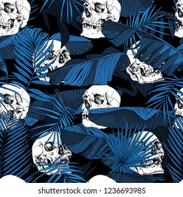 Seamless pattern. Tropical banana, exotic palm leaves and Human skulls at a dark blue night. Textile composition, hand drawn style print. Vector illustration.