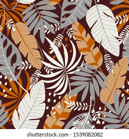 Seamless pattern with tropical brown leaves and plants. Vector background for various surface. Floral seamless vector tropical pattern background with exotic leaves, jungle leaf.