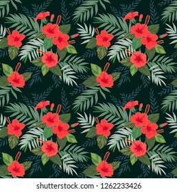 Seamless pattern with tropical flowers and leaves. Hibiscus flowers. Bright jungle pattern with palm leaves and exotic plants. Elegant template with Hawaiian motifs on a black background.