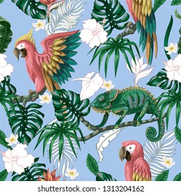 Seamless pattern with tropical flowers, leaves and parrots. Vector