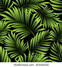 Seamless pattern with tropical, green palm leaves and branches on a black background