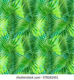 Seamless pattern of tropical intricate green leaves isolated on blue. Tropical wallpaper, textile print, exotic background.